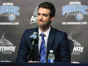 In this Feb. 5, 2015, file photo, Orlando Magic general manager Rob Hennigan pauses to answer a question during a news conference in Orlando, Fla. (Stephen M. Dowell/Orlando Sentinel via AP, File)