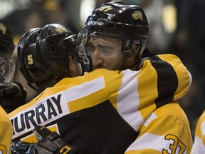 Liam Murray (left) and Stephen Desrocher of the Kingston Frontenacs. (Taylor Bertelink/For The Whig Standard)