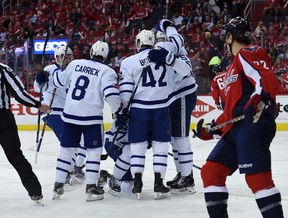 Tyler Bozak of the Toronto Maple Leafs and John Carlson of the