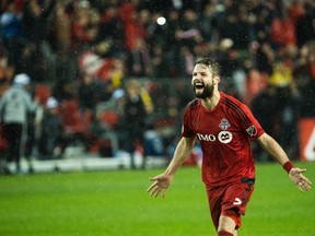 Toronto FC defender Drew Moor (3) reacts after defeating the Montreal Impact during overtime MLS eastern conference playoff soccer final action in Toronto on November 30, 2016. (THE CANADIAN PRESS/Nathan Denette)
