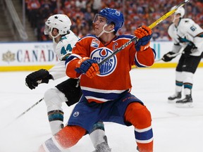 Edmonton's Connor McDavid (97) battles San Jose's Marc-Edouard Vlasic (44) during the third period of a Stanley Cup playoffs game between the Edmonton Oilers and the San Jose Sharks at Rogers Place in Edmonton on Wednesday, April 12, 2017. (Ian Kucerak / Postmedia)