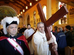 The First Station of the Cross at St. Anthony of Padua Church. Parishioners from St. Anthony's church performed the Way of the Cross during Good Friday in Little Italy on April 14, 2017.