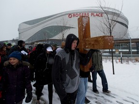 Participants take part in the Way of the Cross through downtown Edmonton on Friday April 14, 2017. (Greg Southam/Postmedia)