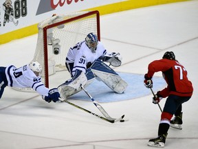 Toronto Maple Leafs goalie Frederik Andersen makes a save in front of defenceman Morgan Rielly and Washington Capitals right winger T.J. Oshie during Game 1 of an NHL playoff series on April 13, 2017. (AP Photo/Molly Riley)