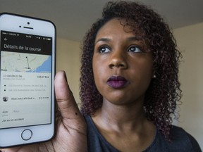 Adeline Louison poses for a photo in her home in Toronto, Ont. on Friday April 14, 2017. Louison says she is falsely accused by an Uber driver of vomiting in his car. She is disputing the $150 charge. (Ernest Doroszuk/Toront