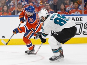 Edmonton Oilers'Drake Caggiula shoots past San Jose's Brent Burns during their opening game of the Stanley Cup playoffs at Rogers Place in Edmonton on Wednesday, April 12, 2017. (Ian Kucerak)