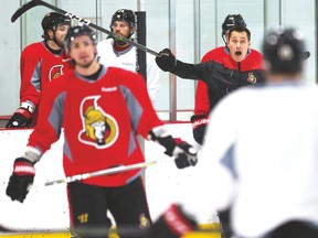 Coach Guy Boucher barks out orders at Senators practice on Friday. (Wayne Cuddington/Postmedia Network)