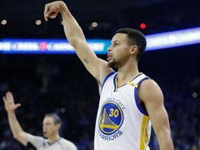 In this Nov. 28, 2016, file photo, Golden State Warriors' Stephen Curry follow through as he makes a 3-point basket against the Atlanta Hawks during the first half of an NBA basketball game, in Oakland, Calif. (AP Photo/Marcio Jose Sanchez, File)