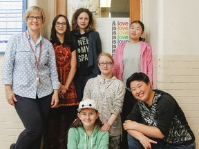 Teacher Virginia Puddicombe, left, with a few of the Grade 9 through Grade 12 student members in the Gender and Sexuality Alliance (GSA) at Kingston Collegiate. (Julia McKay/The Whig-Standard/Postmedia Network)