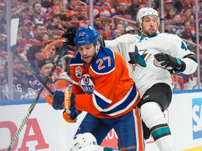 Milan Lucic of the Edmonton Oilers hits Brenden Dillon of the San Jose Sharks in Game 2 of their first-round playoff series at Rogers Place in Edmonton on April 14, 2017. (Shaughn Butts)