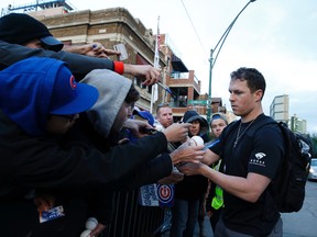 Chris Coghlan, then a member of the Chicago Cubs, signs autographs as he arrives at Wrigley Field prior to Game 3 of the World Series on Oct. 27, 2016. Coghlan is  now a member of the Toronto Blue Jays (NAM Y. HUH/AP files)
