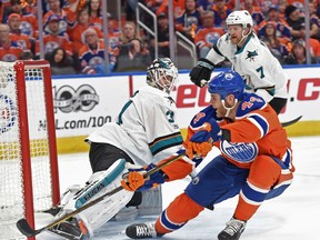 Zack Kassian of the Edmonton Oilers slides the puck wide of San Jose Sharks goalie Martin Jones's net at Rogers Place in Edmonton on April 14, 2017. (Shaughn Butts)