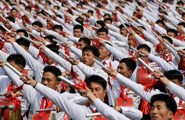North Korean men beat drums as they parade across Kim Il Sung Square during a military parade on Saturday, April 15, 2017, in Pyongyang, North Korea to celebrate the 105th birth anniversary of Kim Il Sung, the country's late founder and grandfather of current ruler Kim Jong Un. (AP Photo/Wong Maye-E)