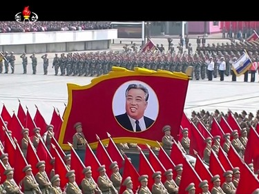 In this image made from video broadcast by North Korean broadcaster KRT, a portrait of the country's founder Kim Il Sung is carried during a parade at Kim Il Sung Square in Pyongyang, Saturday, April 15, 2017. North Korean leader Kim Jong Un has appeared in a massive parade in the capital, Pyongyang, celebrating the birthday of his late grandfather and North Korea founder Kim Il Sung. (KRT via AP) ORG XMIT: TKMY801