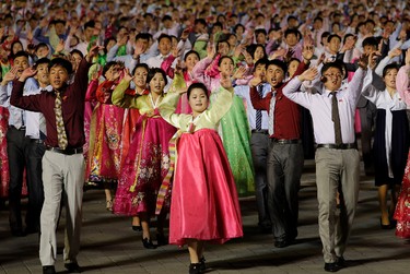 North Koreans participate in a mass dance on Saturday, April 15, 2017, in Pyongyang, North Korea to celebrate the 105th birth anniversary of Kim Il Sung, the country's late founder and grandfather of current ruler Kim Jong Un. (AP Photo/Wong Maye-E)