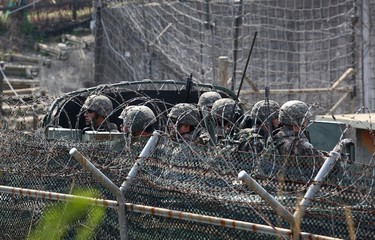 A South Korean military truck carrying soldiers moves along barbed-wire fences in Paju, South Korea, near the border with North Korea, Saturday, April 15, 2017. U.S. President Donald Trump's tweets are adding fuel to a "vicious cycle" of tensions on the Korean Peninsula, North Korea's vice foreign minister told The Associated Press in an exclusive interview Friday. The official added that if the U.S. shows any sign of "reckless" military aggression, Pyongyang is ready to launch a pre-emptive strike of its own. (AP Photo/Ahn Young-joon)