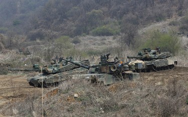 South Korea and U.S. Army tanks move during a joint military exercise between the U.S. and South Korea in Paju, South Korea, near the border with North Korea, Saturday, April 15, 2017. U.S. President Donald Trump's tweets are adding fuel to a "vicious cycle" of tensions on the Korean Peninsula, North Korea's vice foreign minister told The Associated Press in an exclusive interview Friday. The official added that if the U.S. shows any sign of "reckless" military aggression, Pyongyang is ready to launch a pre-emptive strike of its own. (AP Photo/Ahn Young-joon)
