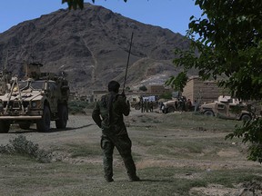 U.S. forces and Afghan commandos are seen in Asad Khil village near the site of a U.S. bombing in the Achin district of Jalalabad, east of Kabul, Afghanistan, Saturday, April 17, 2017. U.S. forces in Afghanistan on Thursday struck an Islamic State tunnel complex in eastern Afghanistan with the largest non-nuclear weapon every used in combat by the U.S. military, Pentagon officials said. (AP Photo/Rahmat Gul)