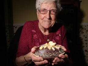 Chocolate lovers will be hunting for thousands of Easter eggs this weekend, but none will find a treasure so rare as this chocolate delight that is almost 100 years old. The Egg, decorated with a white dove on a candied nest, is an heirloom that belongs to 90-year-old Helen Forler, of Elmvale, north of Barrie.
Helen, who is nicknamed “the roadrunner” because of her busy active lifestyle, inherited the chocolate treasure and the cherished memories that came with it. It was a birthday present to her baby brother, George, who was born at Easter time 94 years ago. She is now looking for a good home for it. (TRACY McLAUGHIN/Toronto Sun)