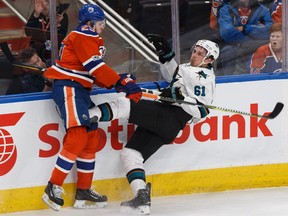 Edmonton's Leon Draisaitl (29) hits San Jose's Justin Braun (61) during the first period of a Stanley Cup playoffs game between the Edmonton Oilers and the San Jose Sharks at Rogers Place in Edmonton on Friday, April 14, 2017.