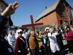 Parishioners from St. Anthony's church performed the Way of the Cross on Good Friday in Little Italy on April 14, 2017.
