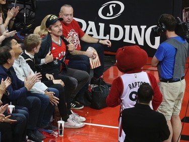 Actor Ethan Hawke shows off his Raptors spirit during the first half of Game 1 in Toronto, Ont. on Saturday April 15, 2017. Jack Boland/Toronto Sun/Postmedia Network