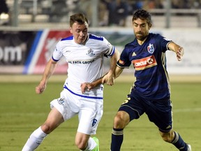 FC Edmonton midfielder Nik Ledgerwood, left, fends off North Carolina FC midfielder Austin Da Luz in North American Soccer League play on Saturday, April 15 at WakeMed Soccer Park in Cary, North Carolina. North Carolina FC won 3-1.