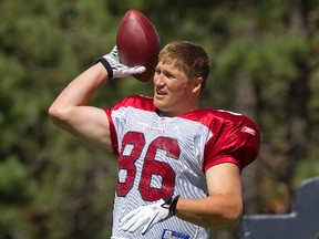 In this Aug. 4, 2011 file photo, Arizona Cardinals' Todd Heap warms up at NFL football training camp in Flagstaff, Ariz. Police say Heap was behind the wheel of the truck when he accidentally struck his 3-year-daughter while moving the vehicle forward outside their home in Mesa Friday, April 14, 2017. Officials said the girl was taken to a hospital where she was pronounced dead. Mesa police said impairment was not a factor. (AP Photo/Matt York)