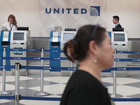 Passengers arrive for flights at the United Airlines terminal at O'Hare International Airport on April 12, 2017 in Chicago, Illinois. United Airlines has been struggling to repair their corporate image after a cell phone video was released showing a passenger being dragged from his seat and bloodied by airport police after he refused to leave a reportedly overbooked flight that was preparing to fly from Chicago to Louisville. (Photo by Scott Olson/Getty Images)