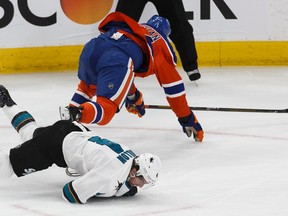 Edmonton Oilers forward Zack Kassian mows down San Jose Sharks defenceman Brenden Dillon in Game 2 of their opening-round playoff series at Rogers Place in Edmonton on Friday, April 14, 2017. (Ian Kucerak)