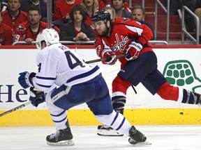 Capitals forward Tom Wilson (right) shoots and scores the game-winning goal in front of Leafs defenceman Morgan Rielly in overtime of Game 1 of their first-round playoff series in Washington, DC, on Thursday, April 13, 2017. (Patrick Smith/Getty Images)