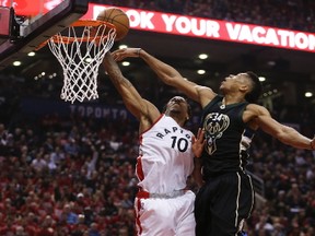 Bucks' Giannis Antetokounmpo (right) blocks Raptors' DeMar DeRozan during first half NBA playoff action in Game 1 of their Eastern Conference series in Toronto on Saturday, April 15, 2017. (Jack Boland/Toronto Sun)