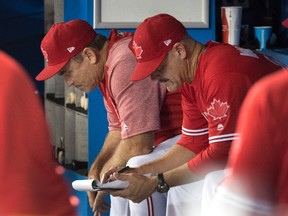 Blue Jays manager John Gibbons (left) and pitching coach Pete Walker are looking for answers. CP