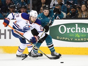 Leon Draisaitl of the Edmonton Oilers battles for control of the puck against Justin Braun of the San Jose Sharks during Game 3 of their opening playoff round series at AP Center on April 16, 2017, in San Jose, Calif. (Thearon W. Henderson/Getty Images)