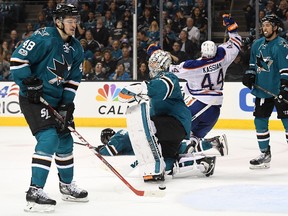 Goalie Martin Jones, Tomas Hertl, left, and Brenden Dillon, right, of the San Jose Sharks react after Zack Kassian of the Edmonton Oilers scored on the way to a 1-0 victory in Game 3 of their opening round playoff series at SAP Center on April 16, 2017, in San Jose, Calif. (Thearon W. Henderson/Getty Images)