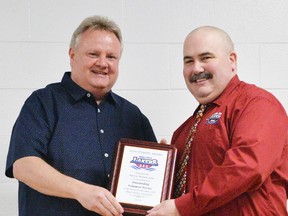 Stratford’s Pete Young (left), president of the Huron-Perth ‘AAA’ Lakers, presents Mitchell’s Kevin Nicholson with the John O’Keefe memorial award for outstanding volunteer work with the hockey organization. KEVIN BOWMAN PHOTO