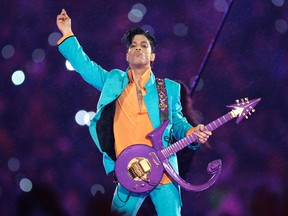 In this Feb. 4, 2007, file photo, Prince performs during the halftime show at the Super Bowl XLI football game in Miami.  (AP Photo/Chris O'Meara, File)