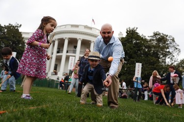 Participants in the annual White House Easter Egg Roll on the South Lawn of the White House in Washington, Monday, April, 17, 2017. President Donald Trump and first lady Melania Trump are set to host the official annual Easter egg roll at the White House. (AP Photo/Carolyn Kaster)