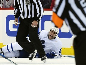 Toronto Maple Leafs defenceman Roman Polak (46) lies on the ice after being injured during the second period of Game 2 against the Washington Capitals in Washington, Saturday, April 15, 2017. (AP Photo/Molly Riley)