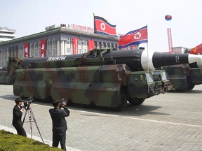 In what military experts say appears to be a North Korean KN-08 Intercontinental Ballistic Missile is paraded across Kim Il Sung Square during a military parade on Saturday, April 15, 2017, in Pyongyang, North Korea to celebrate the 105th birth anniversary of Kim Il Sung, the country's late founder and grandfather of current ruler Kim Jong Un. (AP Photo/Wong Maye-E)