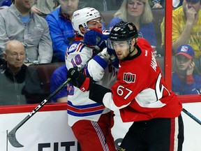 Senators defenceman Ben Harpur (67) checks Rangers' J.T. Miller (10) during first period NHL action in Ottawa on April 8, 2017. Harpur will play Monday night in Boston. (Fred Chartrand/The Canadian Press)