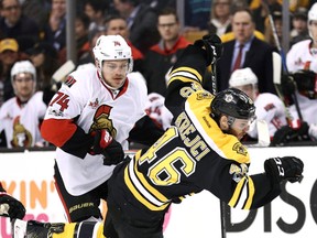 David Krejci #46 of the Boston Bruins is checked by Mark Borowiecki #74 of the Ottawa Senators during the first period at TD Garden on April 6, 2017 in Boston, Massachusetts. (Photo by Maddie Meyer/Getty Images)