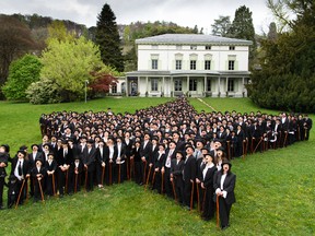 662 people dressed as Charlie Chaplin pose for a group photo in front of the Manoir de Ban during an attempt of the world's largest gathering of people dressed as The Tramp on the occasion of Charlie Chaplin's birthday, and to celebrate the first year of the museum "Chaplin's World by Grevin", in Corsier-sur-Vevey, Switzerland, Sunday, April 16, 2017. (Laurent Gillieron/Keystone via AP)