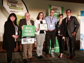 Members of St. Thomas’ cycling community accept the city’s bronze award at Share the Road Cycling Coalition’s annual summit last week in Toronto. The city earned the designation from the provincial cycling advocacy group for its commitment to bike friendliness.  (Contribute)