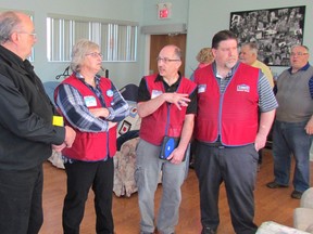 From left,  Dave Ashdown, a board member with Community Concerns for the Medical Fragile, speaks Monday with Lowe's representatives Margaret Butt, Lino Tesolin and Eric Paquette during a tour of Standing Oaks, a residence in Sarnia. Lowe's will be accepting donations for Community Concerns for the Medical Fragile for the next four weeks at its Sarnia store. Paul Morden/Sarnia Observer/Postmedia Network