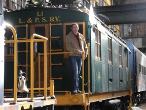 Jeremy Locke, president of the Elgin County Railway Museum, stands on top one of the museum’s trains that is out of the public’s reach due to safety concerns given the poor condition of the building’s roof. The museum has been awarded a federal grant that will allow the building’s roof to be repaired, expanding the area accessible to visitors. JONATHAN JUHA/TIMES-JOURNAL/POSTMEDIA NETWORK
