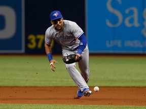 Second baseman Devon Travis of the Toronto Blue Jays makes an attempt to field the infield single by Mallex Smith of the Tampa Bay Rays on April 8, 2017 at Tropicana Field in St. Petersburg, Florida. (Brian Blanco/Getty Images)