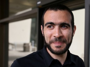 Omar Khadr stands outside the Edmonton Law Courts Buildings on May 7, 2015 after Alberta's highest court released the former Guantanamo Bay detainee on bail pending the appeal of his convictions in the United States. (Tom Braid/Postmedia Network/Files)