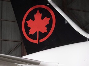 Air Canada has apologized to a family from Prince Edward Island after their 10-year-old boy was bumped off a flight last month that was supposed to take them to Costa Rica. (Mark Blinch/The Canadian Press/Files)