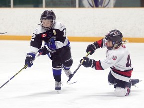 Seth Lagadin of the Walden Devils tries to block Will Mackey's shot of team Bourassa during the minor atom rep semi-final action at the Skater's Edge 3 on 3 Challenge in Sudbury, Ont. on Sunday April 16, 2017. Gino Donato/Sudbury Star/Postmedia Network